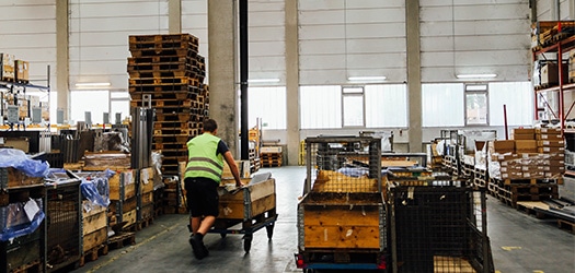 Warehouse-worker-with-drop-trailer-program